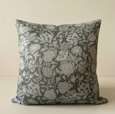 Floral patterned pillow on a beige background