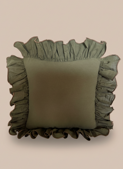 Green 22x22 throw pillow ruffled edges on a beige background